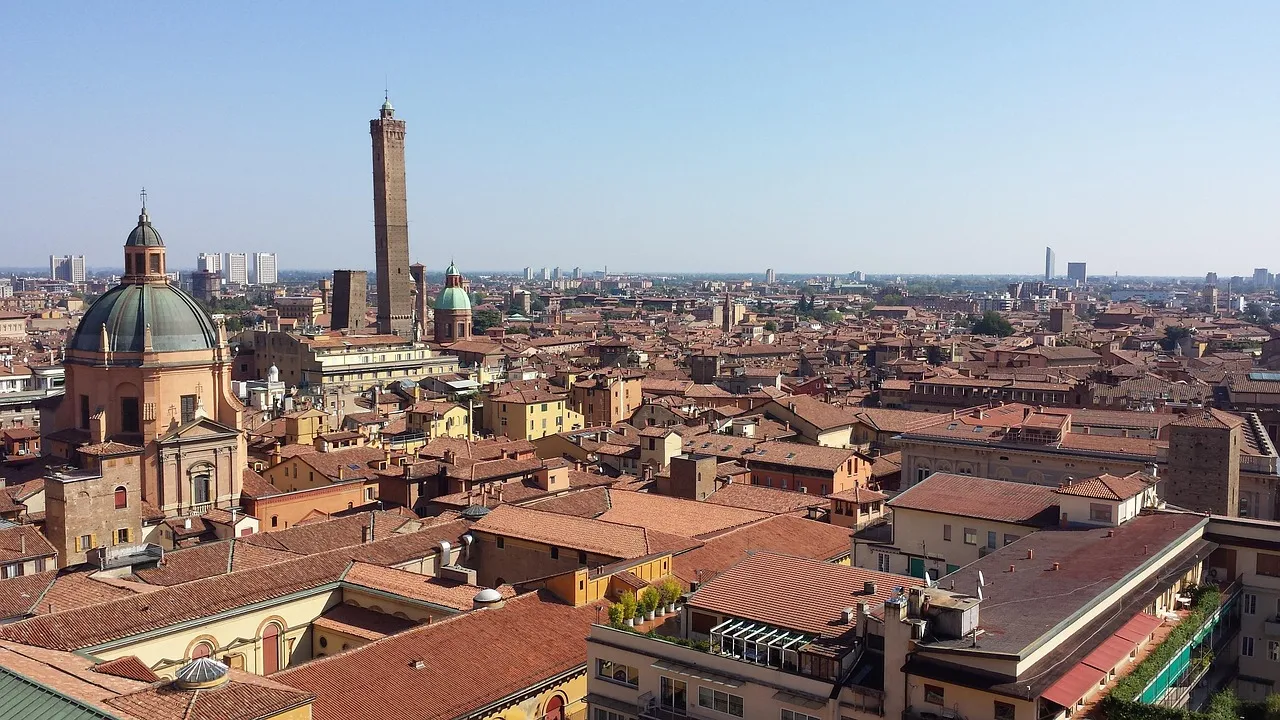 Bologna's red rooftops, domes and medieval towers seen from above