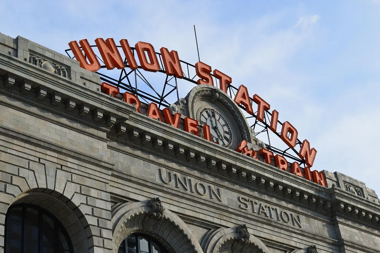 The red neon Union Station sign on the grand old station building in Denver, where the California Zephyr stops