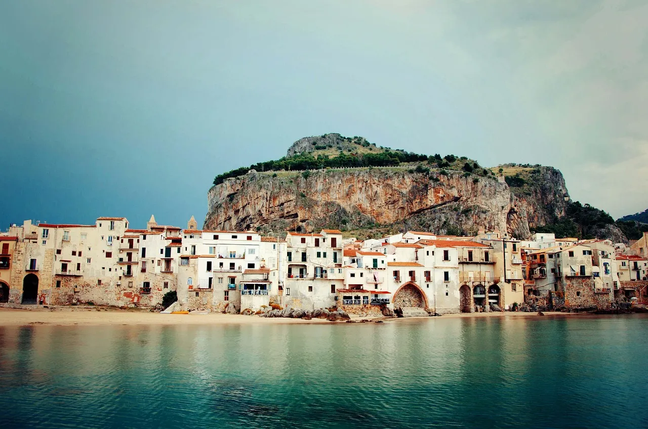 Cefalù's old town on the water, with its great rock rising behind