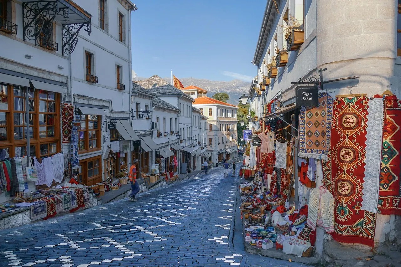 The Old Bazaar street of Gjirokastër, lined with carpets and craft shops