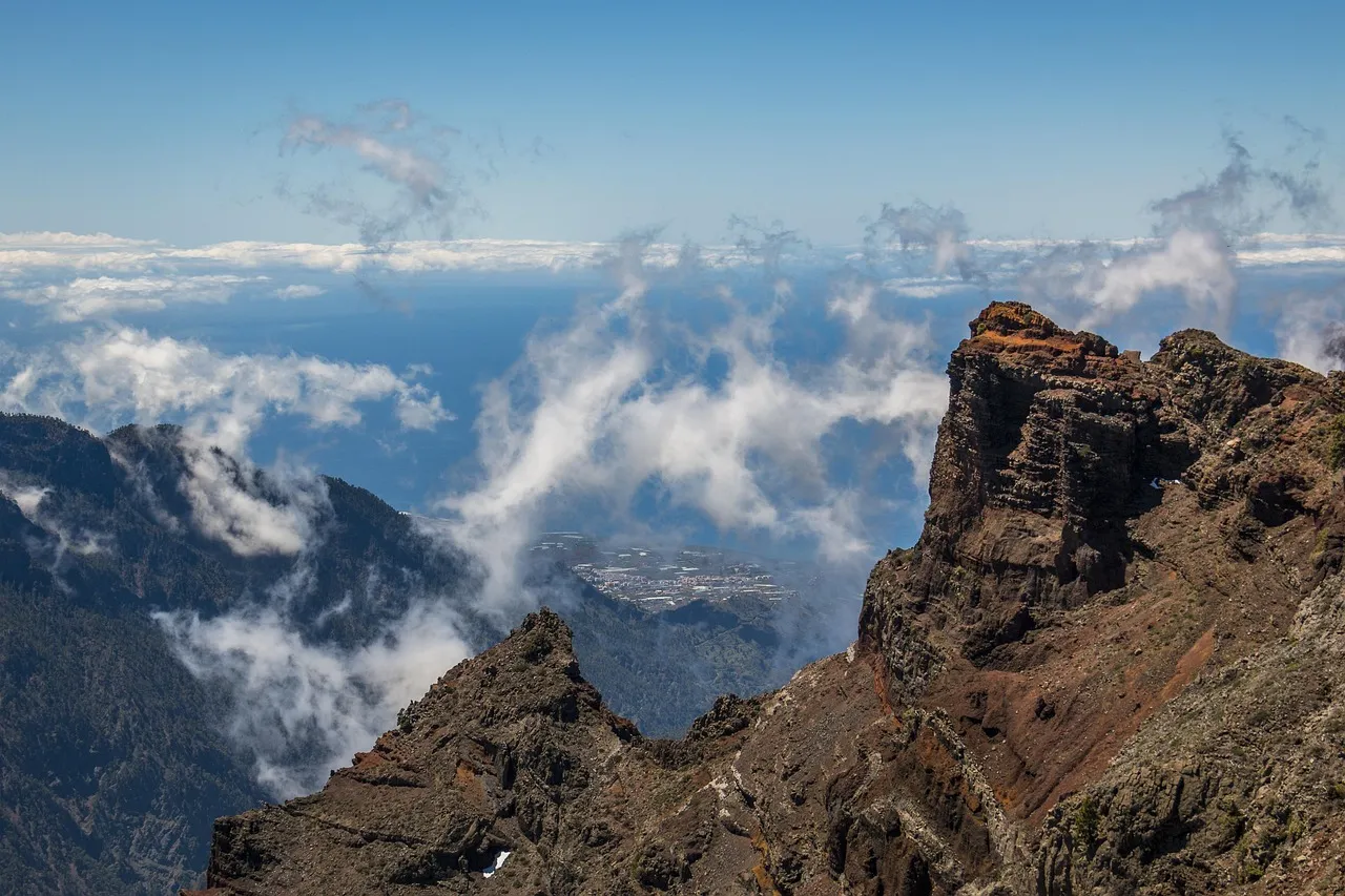 Volcanic peaks rising above a sea of clouds at the Caldera de Taburiente on La Palma