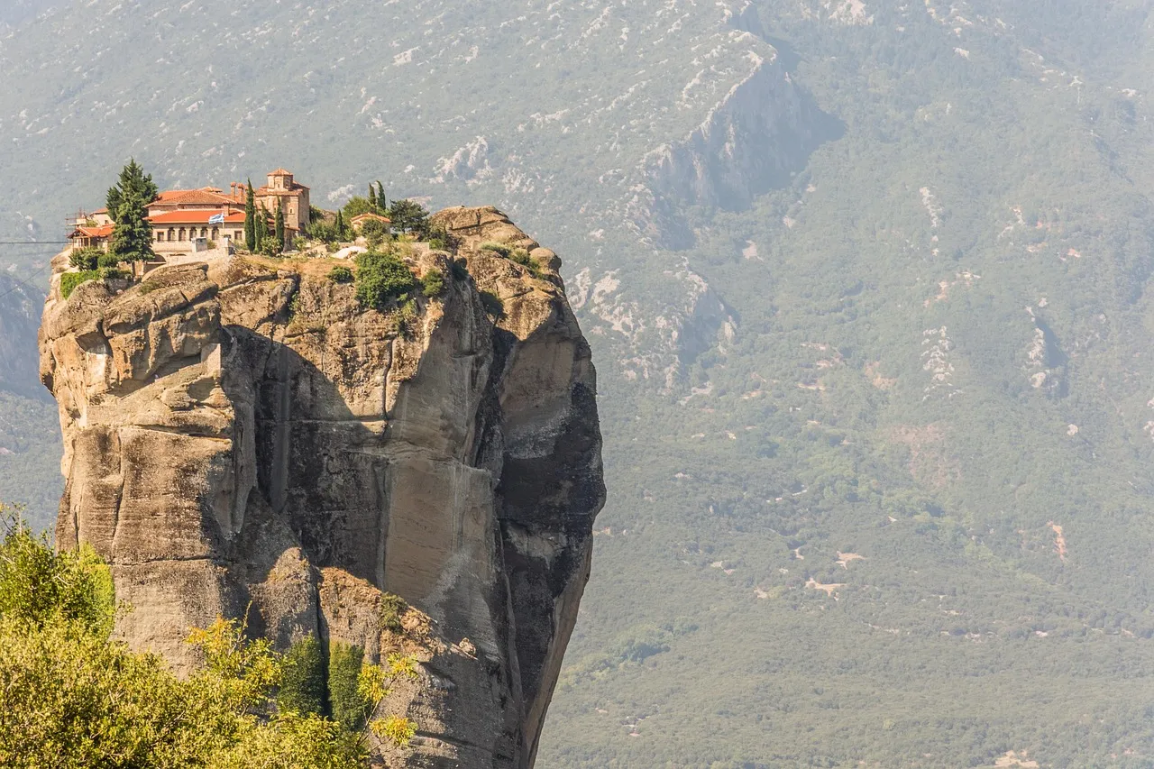 A monastery on top of a sheer rock pillar at Meteora