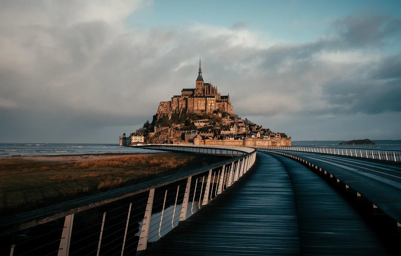 Mont-Saint-Michel at the end of its long bridge across the bay
