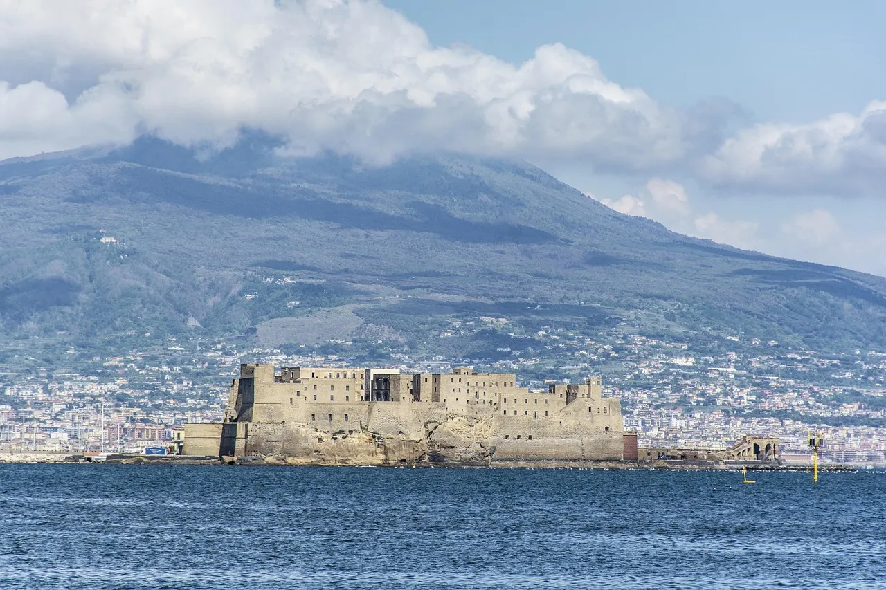 Castel dell'Ovo on the Bay of Naples with Mount Vesuvius behind
