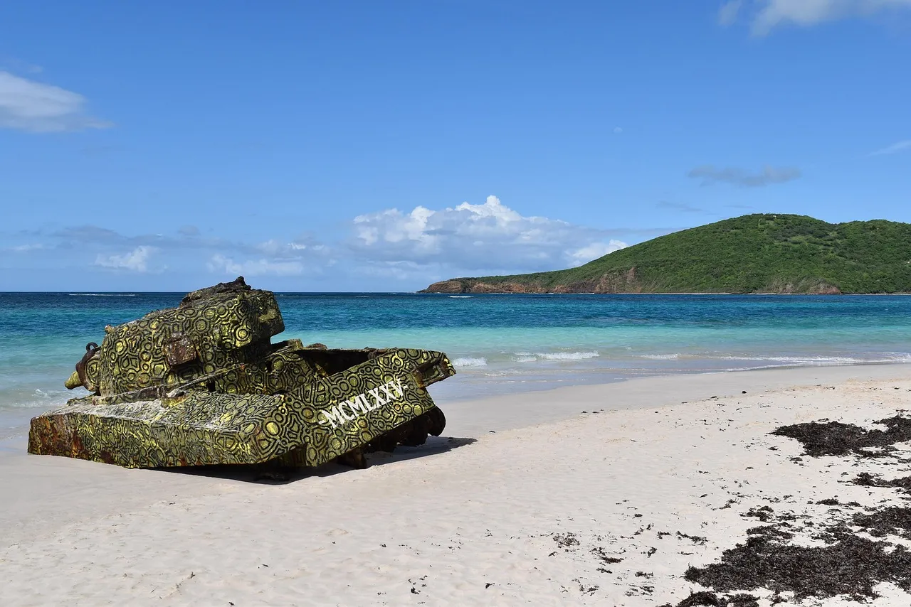 Flamenco Beach on the island of Culebra, Puerto Rico, with white sand, turquoise sea and an old painted tank on the shore