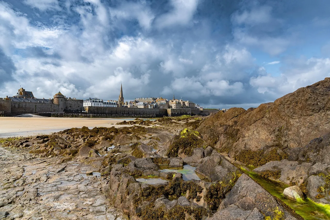 The walled old town of Saint-Malo seen across the rocks at low tide