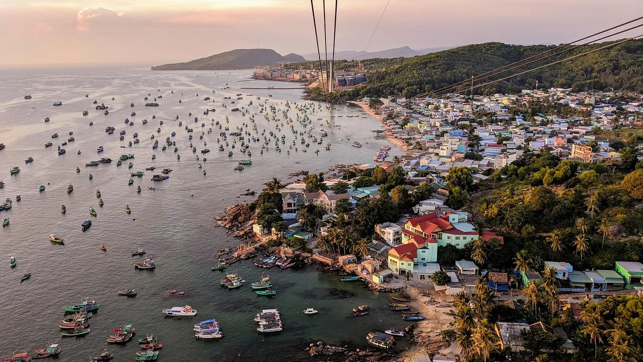 Fishing boats in the bay at An Thoi on Phu Quoc island, with the cable car wires running out over the water