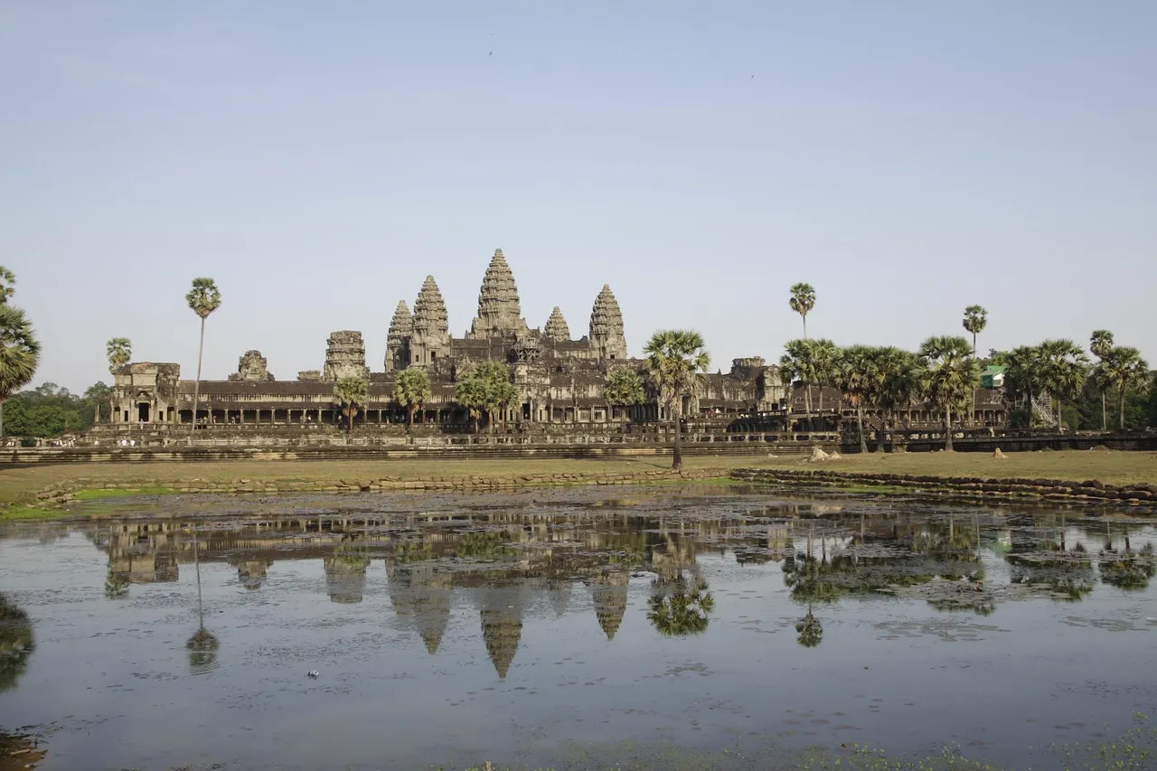 The towers of Angkor Wat reflected in a pond, near Siem Reap