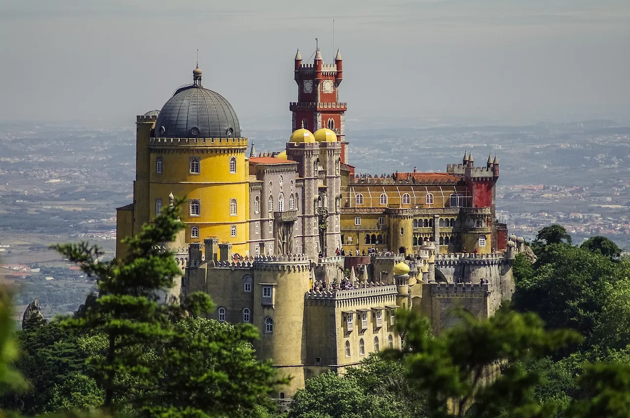The colourful Pena Palace on a forested hilltop in Sintra